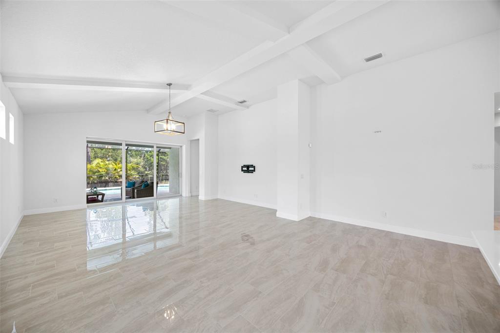 12739 Rainwashed Loop Parrish, FL 34219 - Photo 17 of 45 a view of a livingroom with a ceiling fan and window