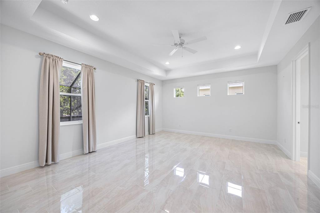 12739 Rainwashed Loop Parrish, FL 34219 - Photo 22 of 45 an empty room with windows and closet
