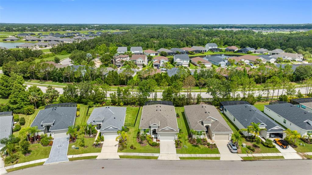 12739 Rainwashed Loop Parrish, FL 34219 - Photo 40 of 45 an aerial view of residential houses with outdoor space and street view