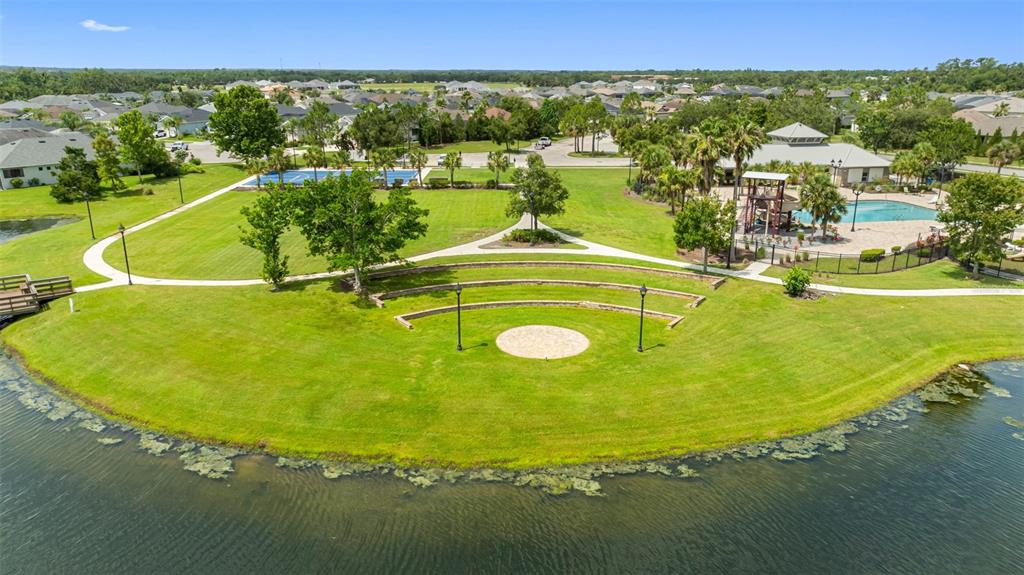 12739 Rainwashed Loop Parrish, FL 34219 - Photo 43 of 45 a view of a swimming pool with lawn chairs