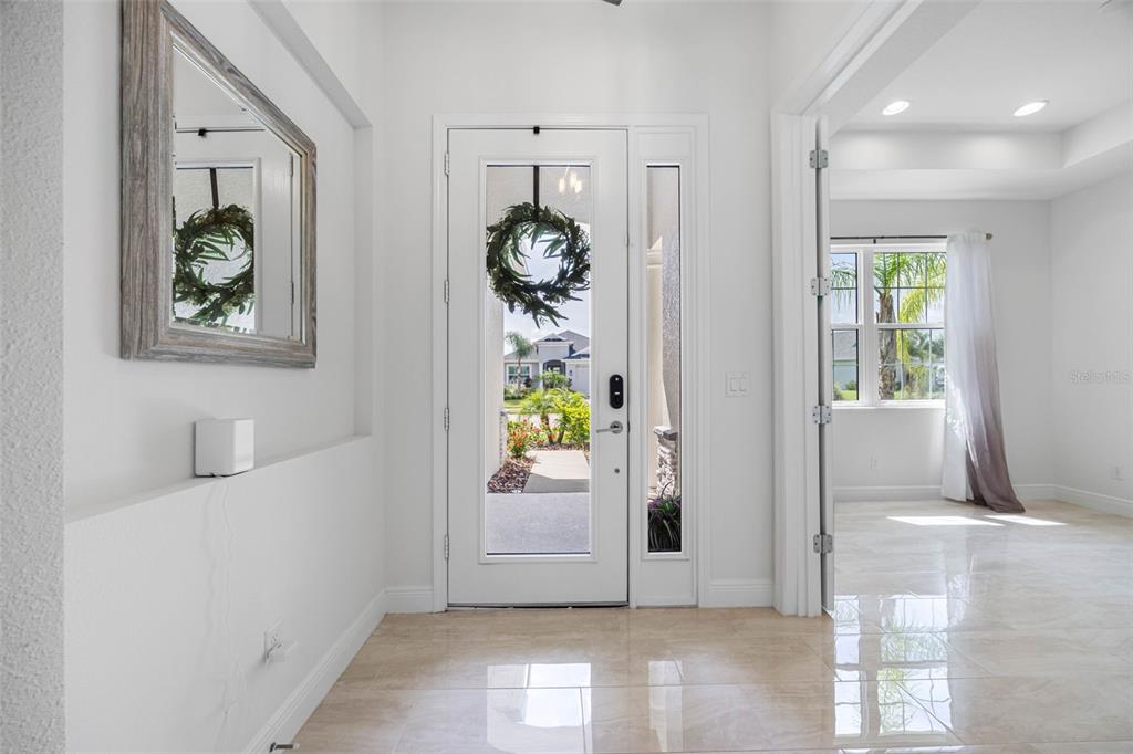 12739 Rainwashed Loop Parrish, FL 34219 - Photo 7 of 45 a view of an entryway and wooden floor
