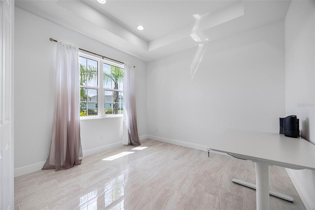 12739 Rainwashed Loop Parrish, FL 34219 - Photo 8 of 45 a view of an empty room with a window