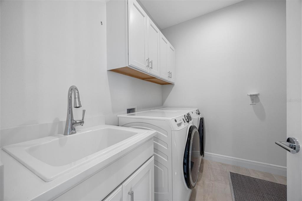 12739 Rainwashed Loop Parrish, FL 34219 - Photo 10 of 45 a utility room with dryer and washer