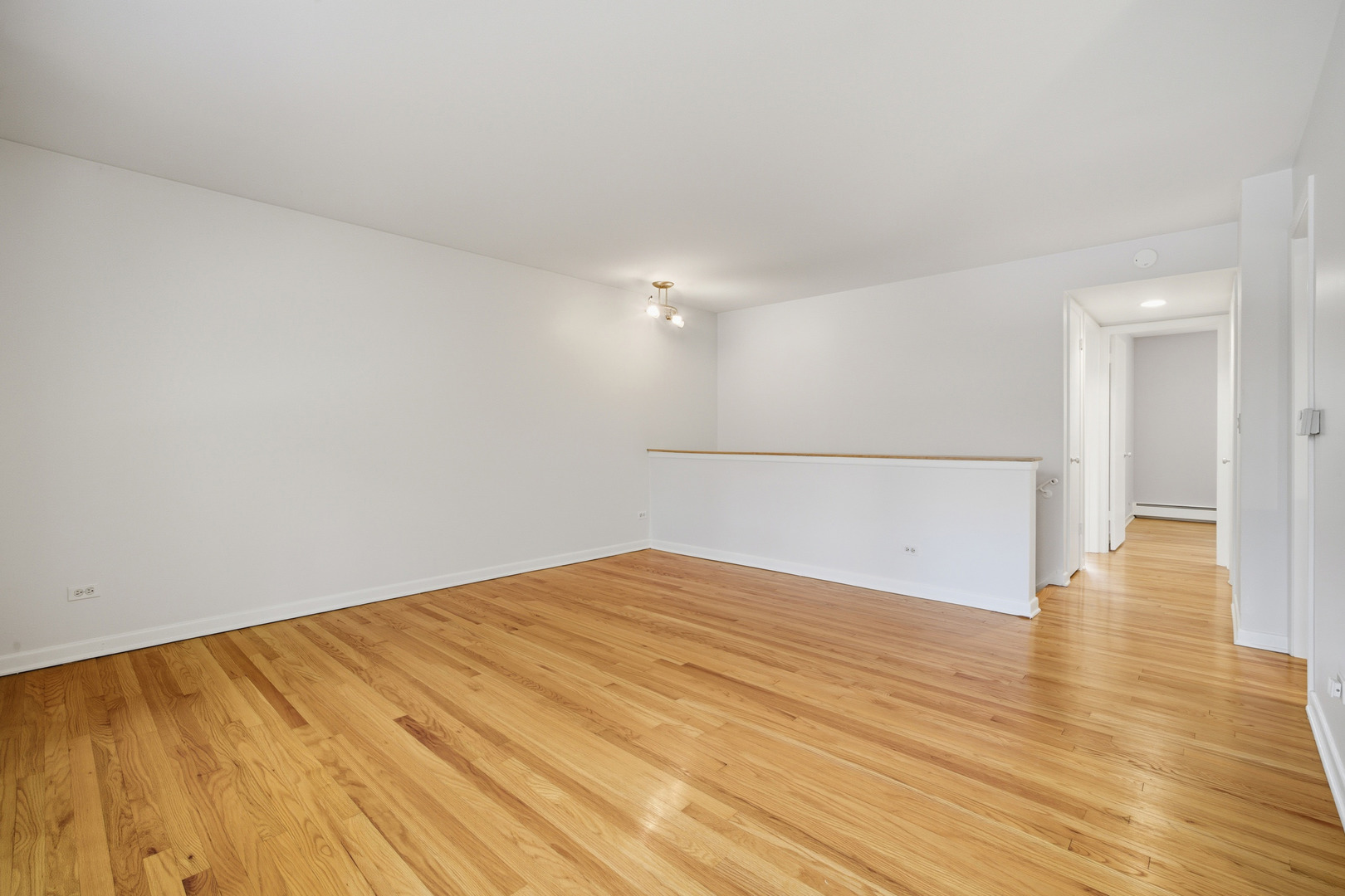 1341 Greenwillow Lane, Unit C Glenview, IL 60025 - Photo 11 of 28 a view of empty room with wooden floor