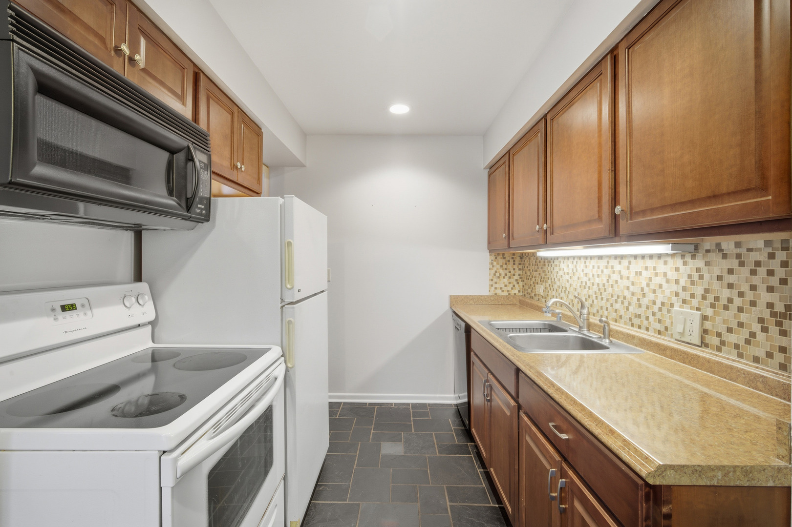 1341 Greenwillow Lane, Unit C Glenview, IL 60025 - Photo 15 of 28 a kitchen with a sink stove and refrigerator