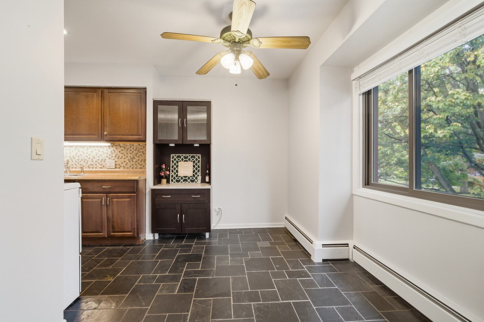 1341 Greenwillow Lane, Unit C Glenview, IL 60025 - Photo 17 of 28 a room with a black white checkered floor with a stove top oven and sink