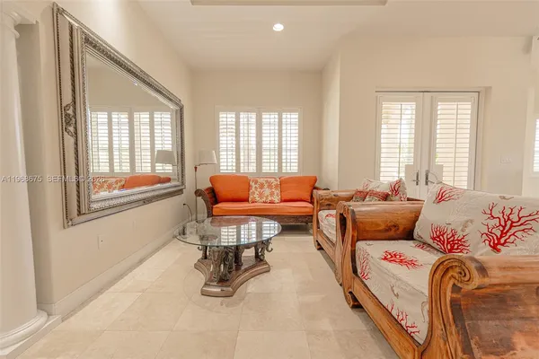 a lobby with furniture and floor to ceiling window