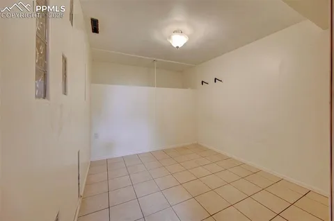a bathroom with a granite countertop shower sink and mirror