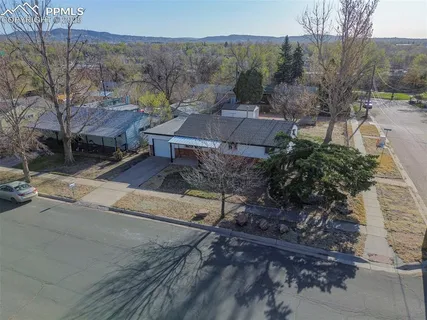 an aerial view of residential house and green space