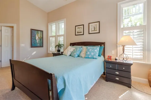 a bedroom with a bed and window