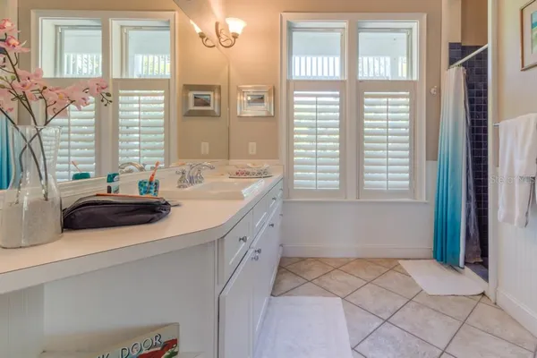 a bathroom with a sink and a window