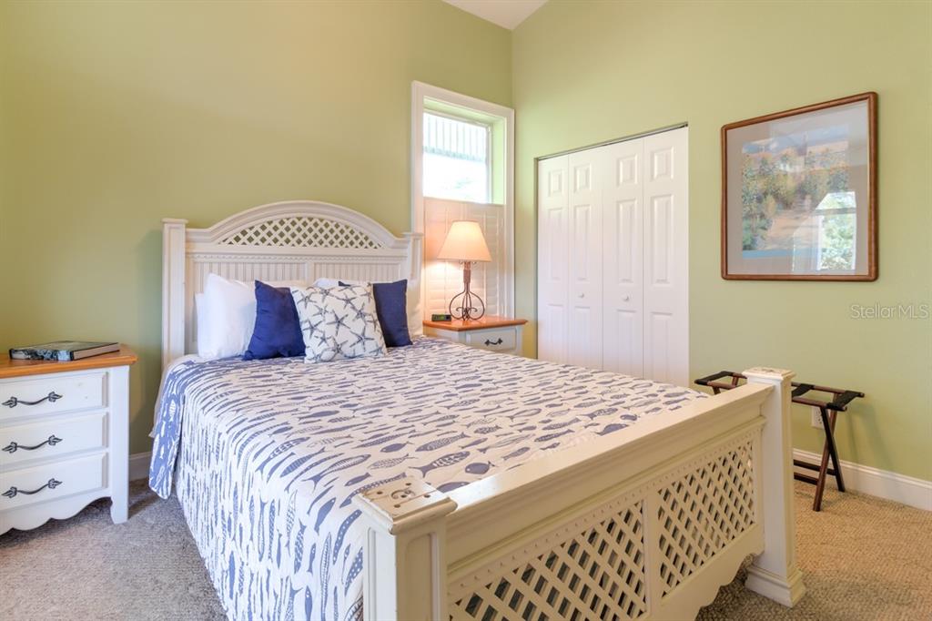 191 Kettle Harbor Drive Boca Grande, FL 33921 - Photo 25 of 50 a bedroom with a bed and a window