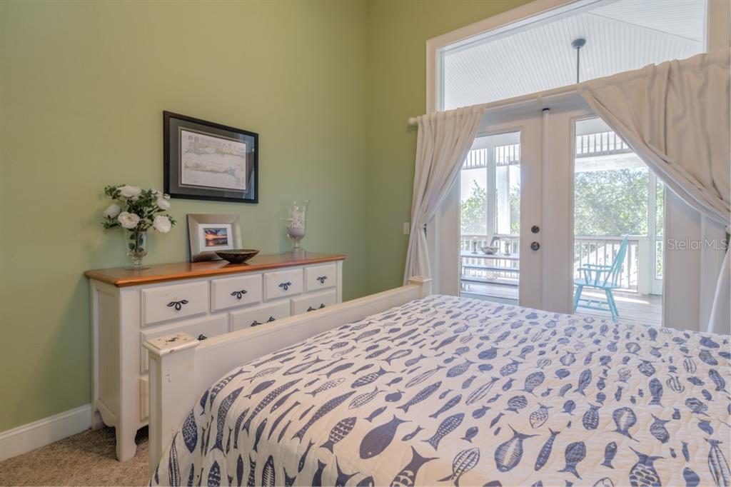 191 Kettle Harbor Drive Boca Grande, FL 33921 - Photo 27 of 50 a bedroom with a large bed and a window