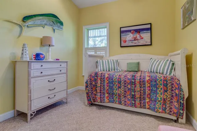 a bedroom with a bed and a dresser