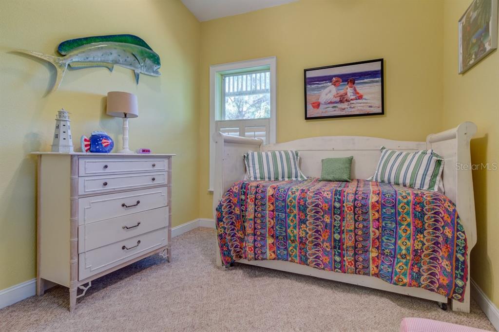 191 Kettle Harbor Drive Boca Grande, FL 33921 - Photo 29 of 50 a bedroom with a bed and a dresser
