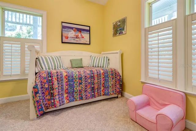 a bed room with a bed and a couch