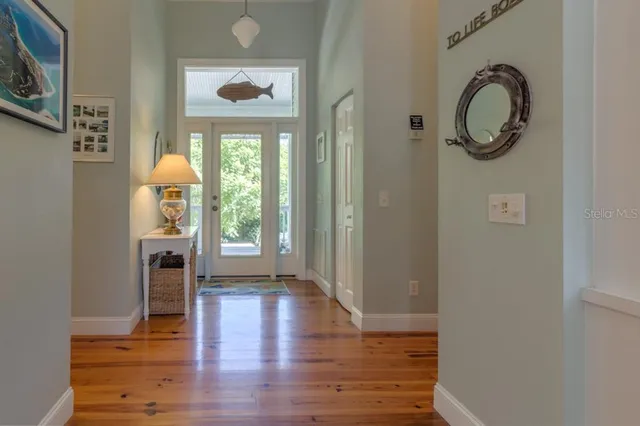 a view of an entryway with wooden floor and a window