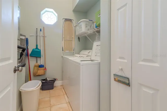 a bathroom with a sink mirror vanity and toilet