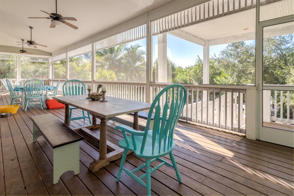 191 Kettle Harbor Drive Boca Grande, FL 33921 - Photo 36 of 50 a view of a dining room with furniture window and wooden floor