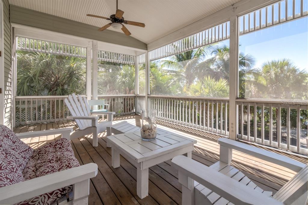 191 Kettle Harbor Drive Boca Grande, FL 33921 - Photo 40 of 50 a living room with large windows