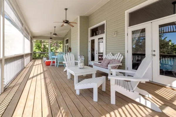 a view of a living room filled with furniture