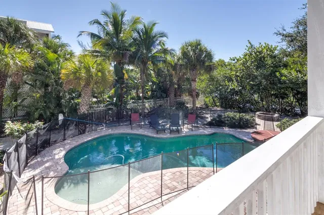 a view of a swimming pool with a patio