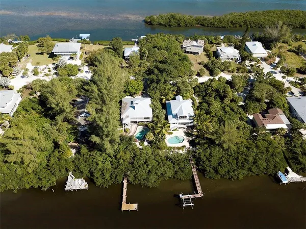 an aerial view of residential house with parking space