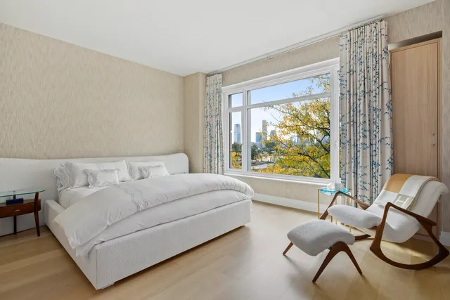 a view of an empty room and a window