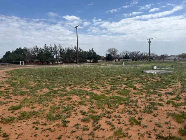 a view of a water with a yard