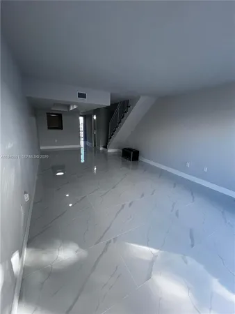 a view of a livingroom with stairs
