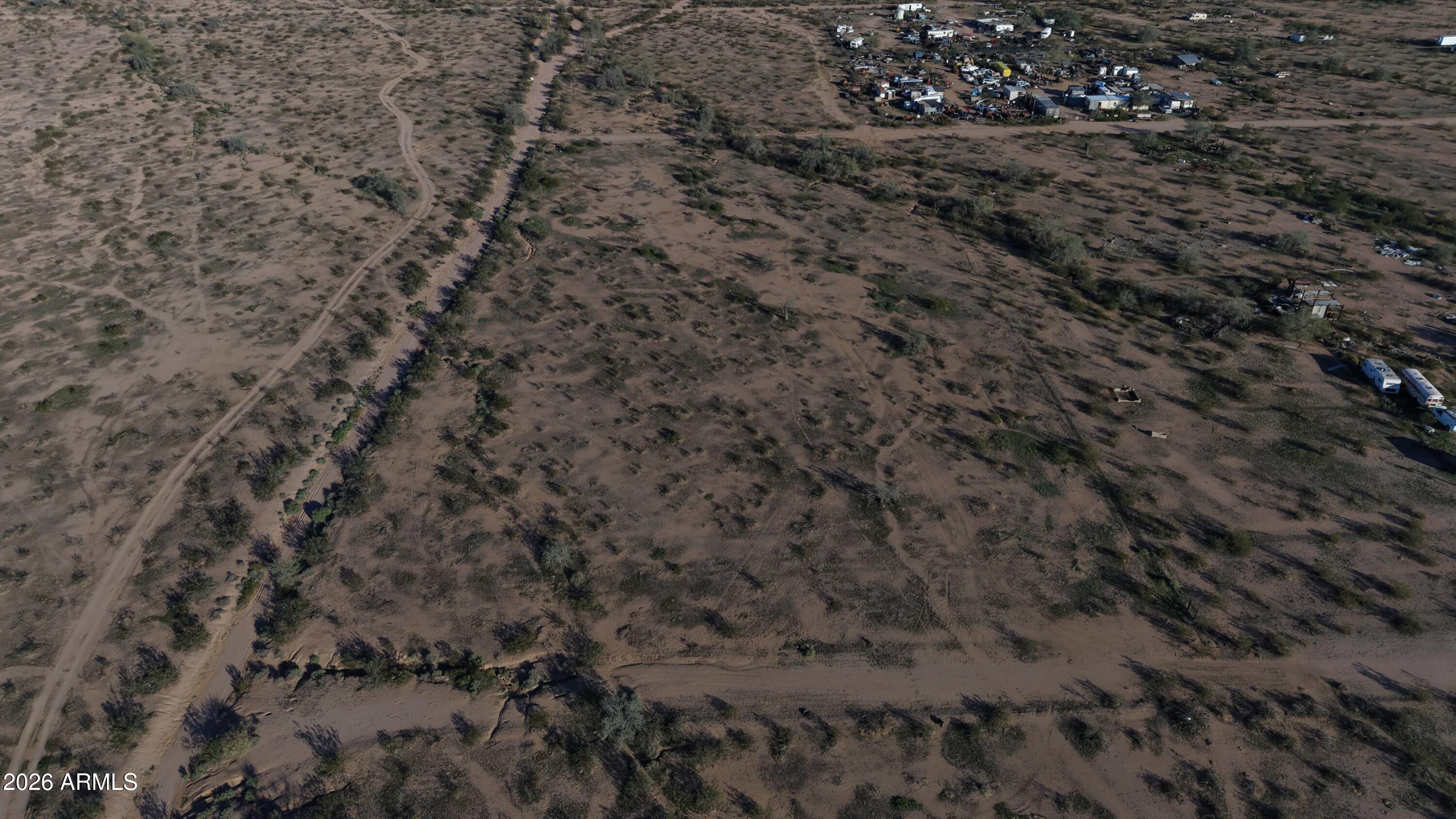 0 Lariat Road, Unit 71 Casa Grande, AZ 85193 - Photo 6 of 16 a view of a dry yard with green space