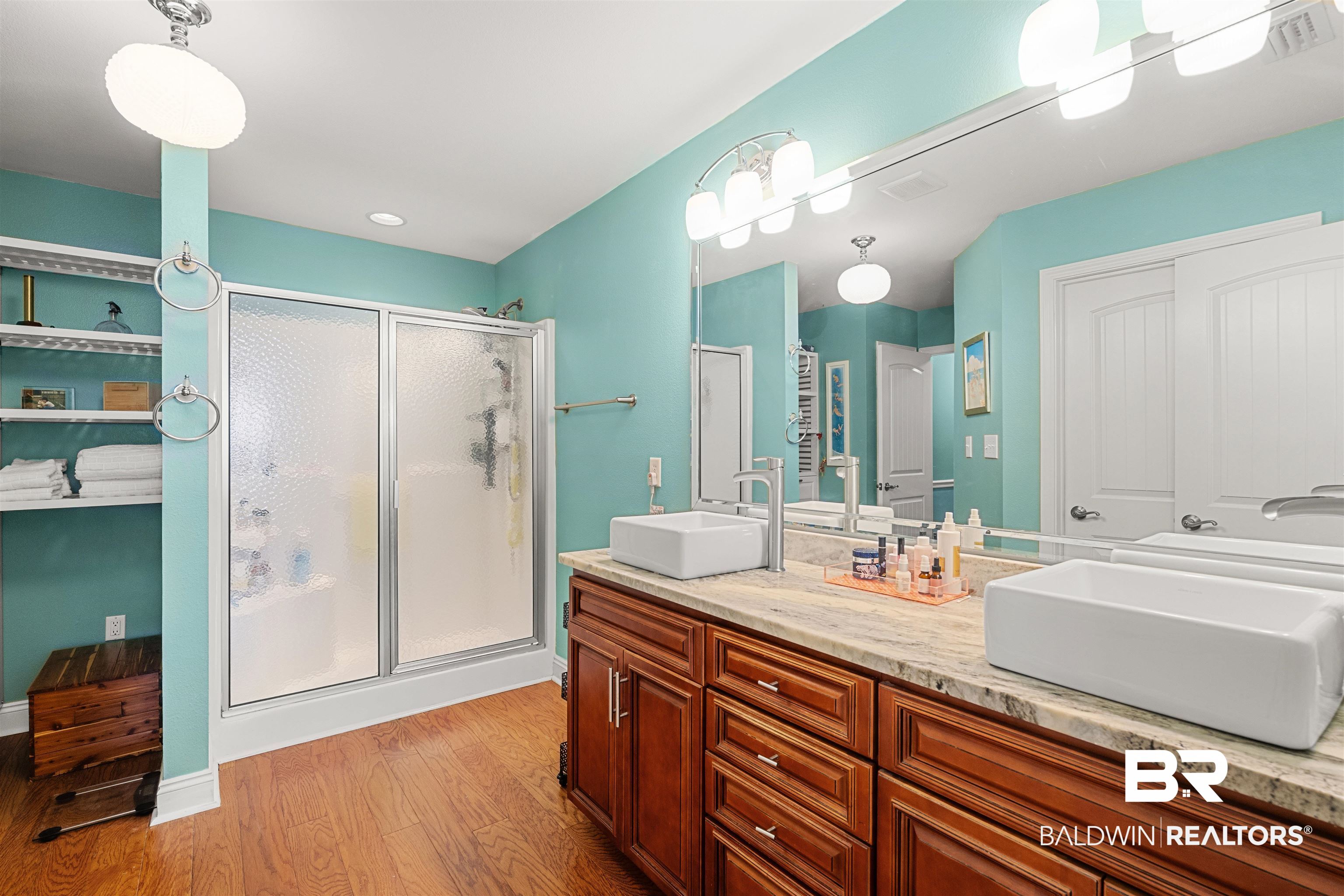 1850 Arcadia Drive Foley, AL 36535 - Photo 23 of 44 Bathroom with a shower stall, visible vents, and a sink