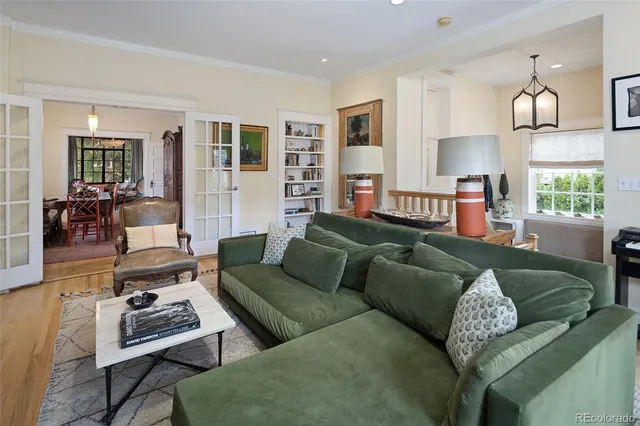 a living room with furniture rug and window