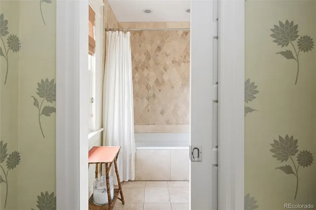 a bathroom with a shower and a sink