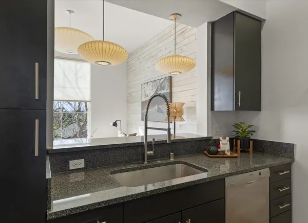 a kitchen with a sink and a window