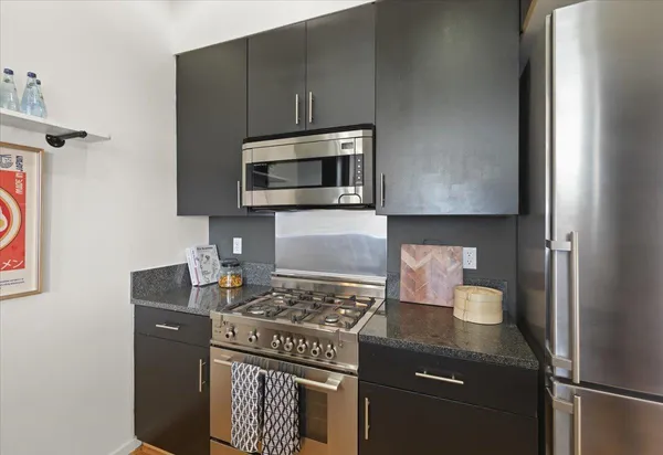 a kitchen with a stove and a microwave