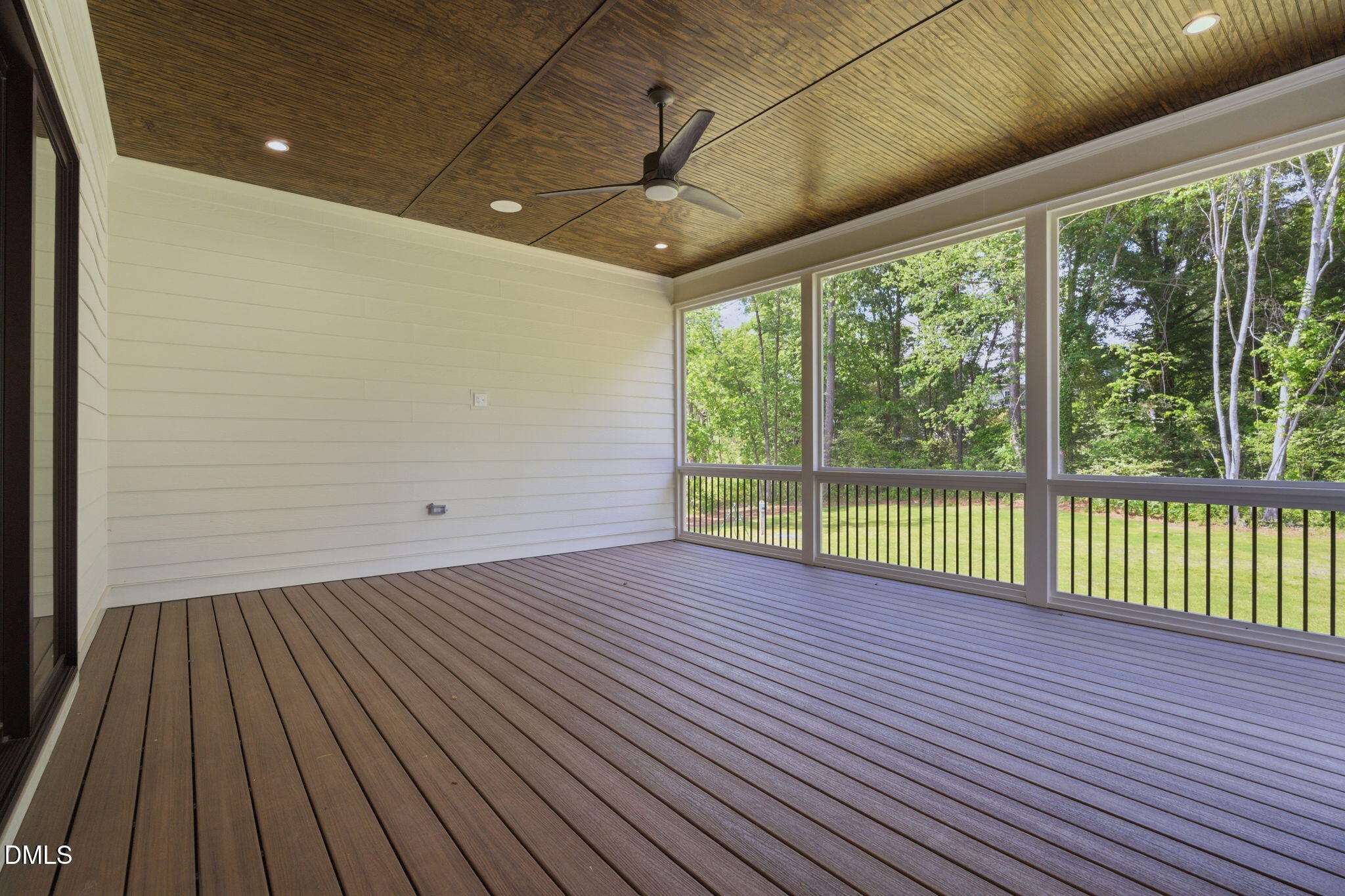 1304 Sanctuary Pond Drive Raleigh, NC 27606 - Photo 44 of 52 a view of a room with wooden floor and large windows