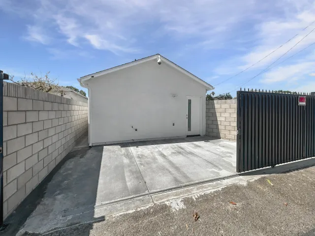 a kitchen with stainless steel appliances granite countertop a wooden floors a stove and a microwave