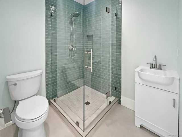 a black car parked in front of a house