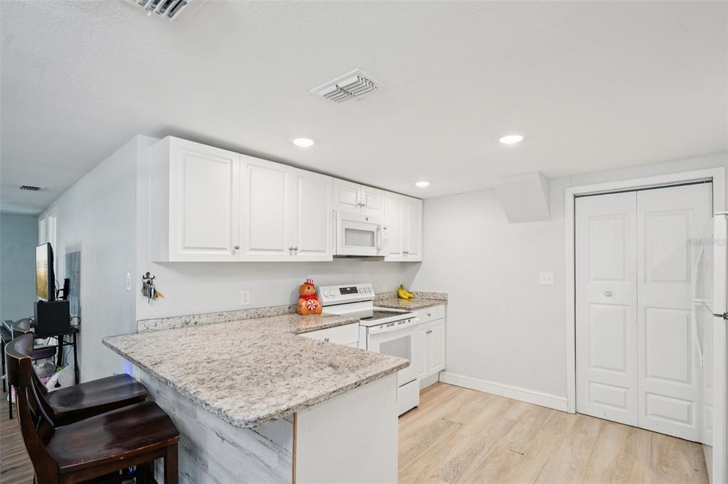 2432 Northwest 2nd Street Ocala, FL 34475 - Photo 12 of 29 a kitchen that has a sink and cabinets in it