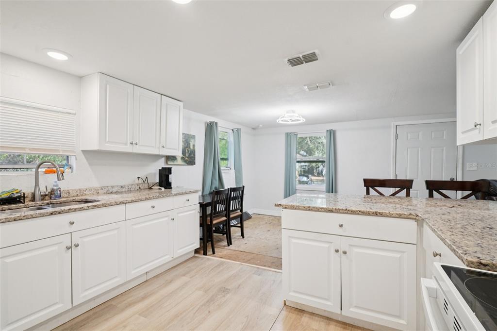 2432 Northwest 2nd Street Ocala, FL 34475 - Photo 14 of 29 a kitchen with granite countertop appliances cabinets and a sink