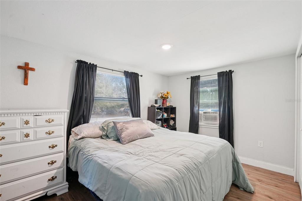 2432 Northwest 2nd Street Ocala, FL 34475 - Photo 16 of 29 a bedroom with a bed and a window