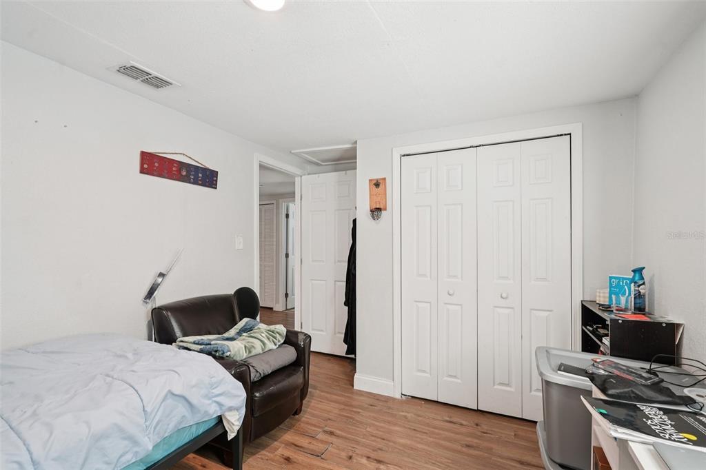 2432 Northwest 2nd Street Ocala, FL 34475 - Photo 18 of 29 a bedroom with a bed and wooden floor