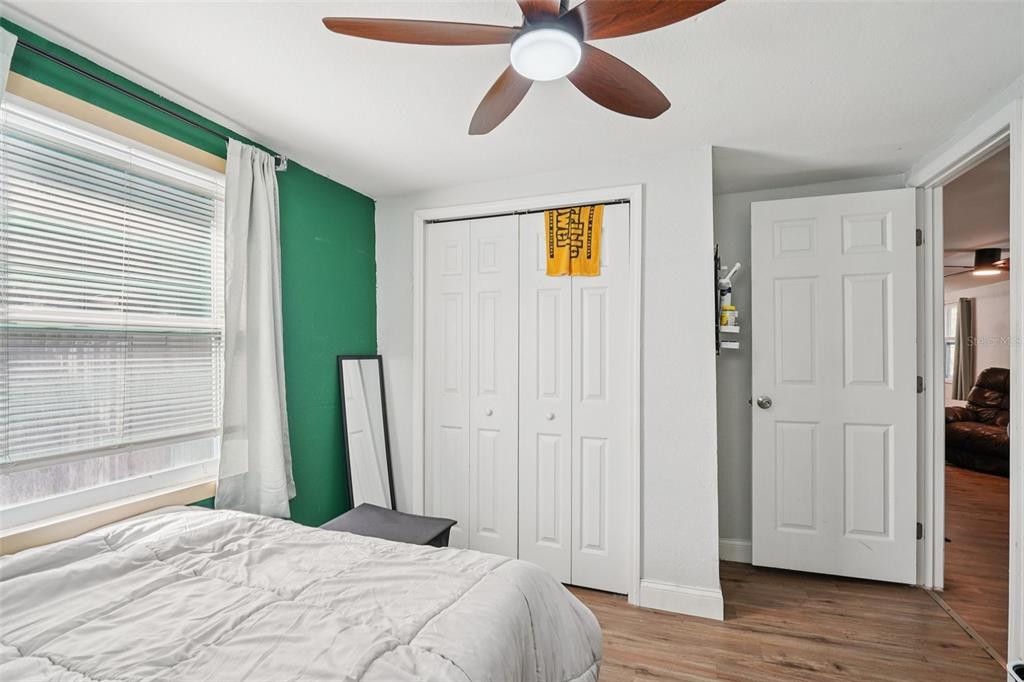 2432 Northwest 2nd Street Ocala, FL 34475 - Photo 20 of 29 a spacious bedroom with a bed and a window