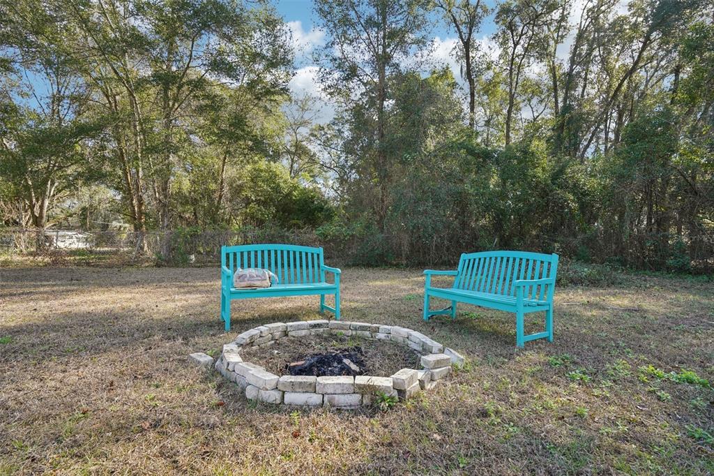 2432 Northwest 2nd Street Ocala, FL 34475 - Photo 28 of 29 a view of a bench in a backyard