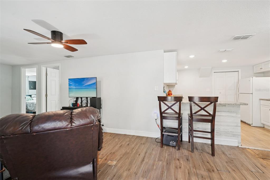 2432 Northwest 2nd Street Ocala, FL 34475 - Photo 6 of 29 a living room with furniture and a wooden floor