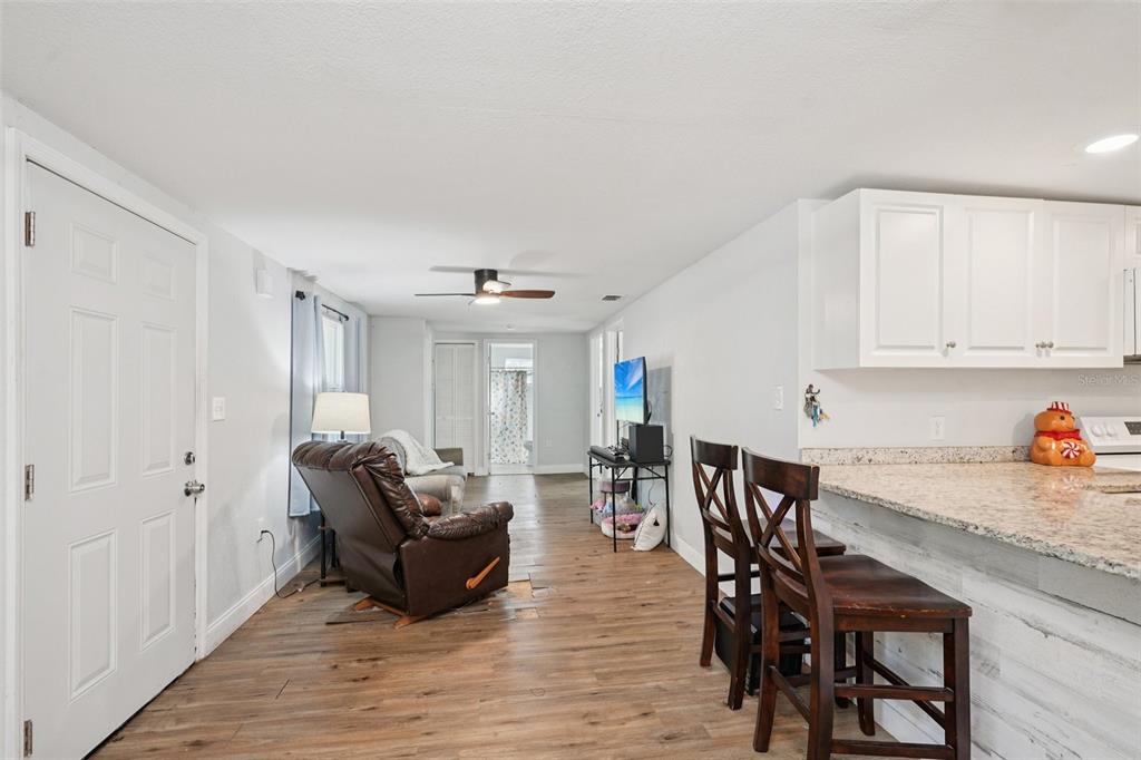 2432 Northwest 2nd Street Ocala, FL 34475 - Photo 7 of 29 a living room with furniture and wooden floor