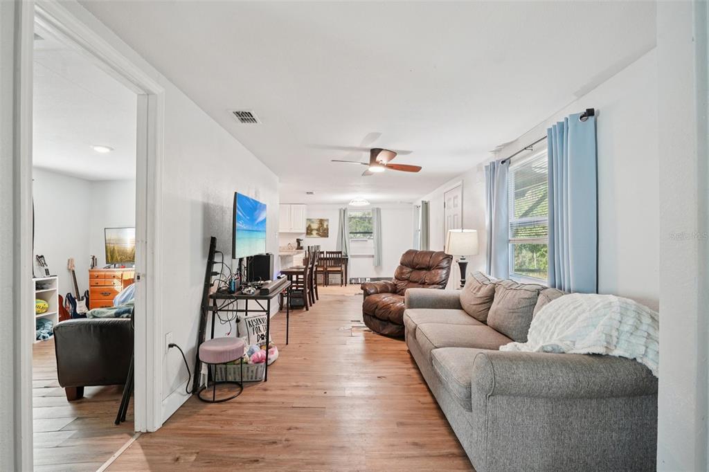 2432 Northwest 2nd Street Ocala, FL 34475 - Photo 8 of 29 a living room with furniture and a large window