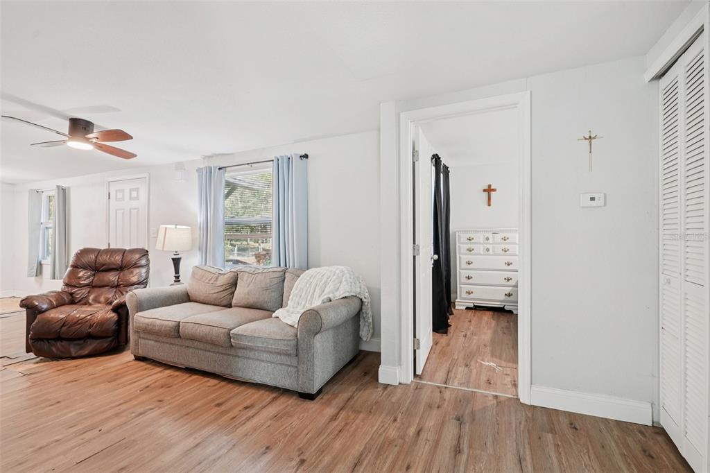 2432 Northwest 2nd Street Ocala, FL 34475 - Photo 9 of 29 a living room with furniture and a walk in closet