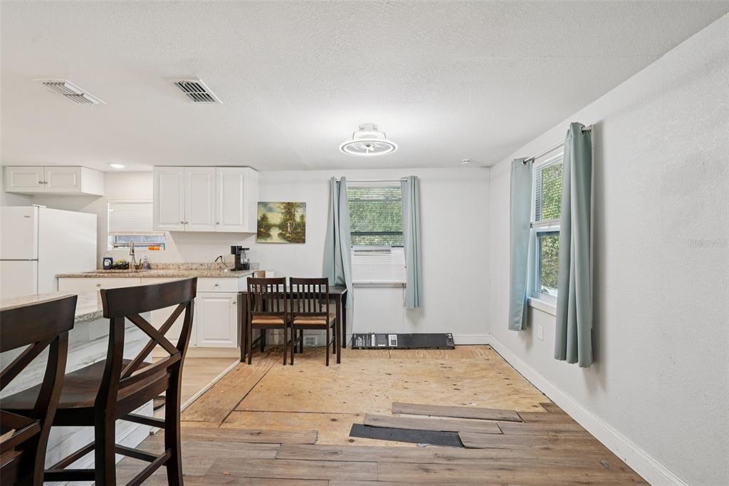 2432 Northwest 2nd Street Ocala, FL 34475 - Photo 10 of 29 a room with stainless steel appliances kitchen island granite countertop furniture and a window